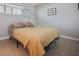Simple bedroom featuring a bed, a small window, and neutral decor at 400 Larboard Way # 103, Clearwater, FL 33767