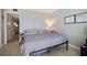 Cozy bedroom with a comfortable bed, simple decor, and a calming gray color scheme at 400 Larboard Way # 103, Clearwater, FL 33767