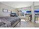 Bedroom showcasing a water view, a desk, a mounted TV, and mirrored closet doors at 400 Larboard Way # 103, Clearwater, FL 33767
