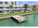 Picturesque waterfront property with a private dock and scenic views, lush green lawns at 400 Larboard Way # 103, Clearwater, FL 33767