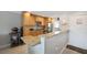 Bright kitchen with granite countertops, stainless steel appliances, and ample storage space at 400 Larboard Way # 103, Clearwater, FL 33767