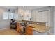 Galley style kitchen featuring granite countertops and stainless-steel appliances at 400 Larboard Way # 103, Clearwater, FL 33767