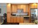 Well-lit kitchen boasting granite countertops, stainless steel appliances, and ample storage at 400 Larboard Way # 103, Clearwater, FL 33767