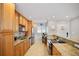 Kitchen offers granite countertops, stainless steel appliances, and ceramic flooring at 400 Larboard Way # 103, Clearwater, FL 33767