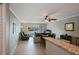 Living area showcases open concept, tile flooring, waterfront views, and comfortable furnishings at 400 Larboard Way # 103, Clearwater, FL 33767