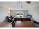The spacious living room offers serene waterfront views, tile floors, and comfortable seating at 400 Larboard Way # 103, Clearwater, FL 33767