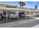 View of covered parking lot with assigned spaces, offering protection from the elements and easy access at 400 Larboard Way # 103, Clearwater, FL 33767