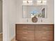 Elegant bathroom featuring double sink vanity with wood cabinetry and modern fixtures at 413 W Park Ave # 1, Tampa, FL 33602