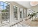 Bright dining room with paneled walls and backyard views from ample windows at 413 W Park Ave # 1, Tampa, FL 33602