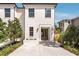 Charming white two-story home with a well-manicured lawn and inviting entrance at 413 W Park Ave # 1, Tampa, FL 33602