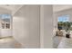 Hallway featuring modern, minimalist white cabinetry extending the length of the wall to maximize storage space at 413 W Park Ave # 1, Tampa, FL 33602
