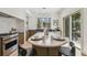 Bright kitchen featuring a central island with seating and premium stainless steel appliances at 413 W Park Ave # 1, Tampa, FL 33602