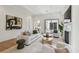 Bright living room with elegant furniture, fireplace, and sliding glass doors at 413 W Park Ave # 1, Tampa, FL 33602