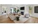 Elegant living room with a fireplace, plush seating, and access to outdoor area at 413 W Park Ave # 1, Tampa, FL 33602