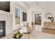 Inviting living room with a fireplace, a cozy chair, and view to the foyer at 413 W Park Ave # 1, Tampa, FL 33602