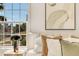 Serene bedroom with plush bedding, neutral decor, and a large window offering natural light and a peaceful atmosphere at 413 W Park Ave # 1, Tampa, FL 33602