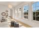 Bright sitting area with natural light from multiple windows, decorated with neutral tones and stylish furniture at 413 W Park Ave # 1, Tampa, FL 33602