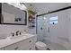 Modern bathroom with white subway tile, glass shower, and stylish vanity at 4426 3Rd N Ave, St Petersburg, FL 33713