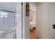 Stylish bathroom featuring a glass-enclosed shower with modern fixtures, next to bedroom entrance at 4426 3Rd N Ave, St Petersburg, FL 33713
