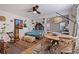 Stylish living room and dining area featuring hardwood floors, ceiling fan, and an open layout perfect for entertaining at 4426 3Rd N Ave, St Petersburg, FL 33713