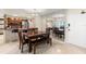 The elegant dining area is next to the modern kitchen and features a mirrored wall and a stylish chandelier at 450 S Gulfview Blvd # 802, Clearwater Beach, FL 33767