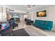 Open-concept living room showcasing seating, marble floors, and views into the dining area at 450 S Gulfview Blvd # 802, Clearwater Beach, FL 33767