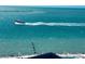 Beautiful turquoise water with a boat offshore, visible from the condominium at 450 S Gulfview Blvd # 802, Clearwater Beach, FL 33767