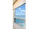 Stunning ocean view from a window, showcasing the beautiful blue waters and sky at 450 S Gulfview Blvd # 802, Clearwater Beach, FL 33767