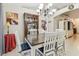 A dining room featuring a chandelier, a dining table and a China cabinet at 4606 Copper Ln, Plant City, FL 33566