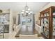 Bright dining room features a chandelier and access to outdoor space through glass paneled doors at 4606 Copper Ln, Plant City, FL 33566