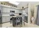 Modern kitchen with stainless appliances, gray cabinets, and a charming island at 4606 Copper Ln, Plant City, FL 33566
