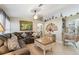 Cozy living room featuring a comfortable sofa, accent chair, and stylish decor elements at 4606 Copper Ln, Plant City, FL 33566