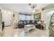 Spacious living room with neutral tones, tile flooring, comfortable seating, and ample natural light at 4606 Copper Ln, Plant City, FL 33566