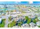 An aerial view of multi-story condos across from an intercoastal waterway in a tropical community at 4611 Duhme Rd # 1A, St Petersburg, FL 33708