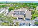 An aerial view of a condominium community featuring covered parking, lush landscaping, and well-maintained grounds at 4611 Duhme Rd # 1A, St Petersburg, FL 33708