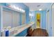 En-suite bathroom with large vanity and dual sinks, and extra storage space at 4611 Duhme Rd # 1A, St Petersburg, FL 33708
