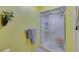 Bathroom features glass enclosed shower with tile surround, neutral color palette, and updated fixtures at 4611 Duhme Rd # 1A, St Petersburg, FL 33708