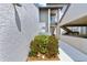 Condo entrance with a landscaped walkway leading to the front door, providing a welcoming first impression at 4611 Duhme Rd # 1A, St Petersburg, FL 33708