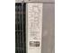 Close up of the data sticker for an HVAC unit including serial number, refrigerant type, and electrical specs at 4611 Duhme Rd # 1A, St Petersburg, FL 33708