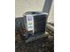 An outdoor AC unit sits on a concrete pad with some fallen leaves underneath the unit at 4611 Duhme Rd # 1A, St Petersburg, FL 33708