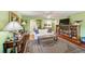 Cozy living area with wood floors, white couch, stylish decor, and abundant natural light at 4611 Duhme Rd # 1A, St Petersburg, FL 33708