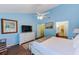 Spacious main bedroom features wood flooring, a ceiling fan, and neutral colored walls at 4611 Duhme Rd # 1A, St Petersburg, FL 33708