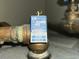 Close up of home pipe fitting shows Watts water regulator set at 150 psi at 210 degrees at 4611 Duhme Rd # 1A, St Petersburg, FL 33708