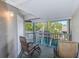 Screened porch with chairs overlooking canal waterway with lush landscaping at 4611 Duhme Rd # 1A, St Petersburg, FL 33708