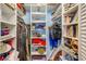 Organized walk-in closet featuring shelving, hanging racks, and ample storage space for clothes, shoes, and accessories at 4611 Duhme Rd # 1A, St Petersburg, FL 33708