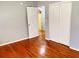 Bedroom featuring hardwood floors, a ceiling fan, and a closet at 5211 Jersey S Ave, Gulfport, FL 33707