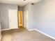 A bedroom featuring carpet flooring, a closet, and white doors at 5211 Jersey S Ave, Gulfport, FL 33707