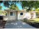 Charming home with a well-manicured lawn and inviting front entrance at 5211 Jersey S Ave, Gulfport, FL 33707