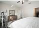 Bedroom featuring an exercise bike, ceiling fan, and dresser with mirror at 5460 Sandy Shell Dr, Apollo Beach, FL 33572