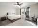 Bedroom featuring a queen bed, exercise bike, ceiling fan and view of the outside at 5460 Sandy Shell Dr, Apollo Beach, FL 33572